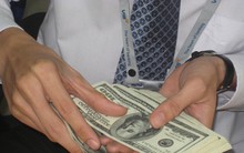 Giá vốn tiền đồng tăng giúp "kìm chân" tỷ giá
