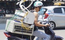 Nắng nóng đỉnh điểm ở Hà Nội, thợ điều hòa kiếm tiền triệu mỗi ngày