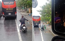 Ấm lòng cảnh người dân Huế dù đang cùng chịu ảnh hưởng bão số 9 vẫn gõ cửa từng chiếc xe xếp hàng trú bão để phát cơm ăn, nước uống miễn phí