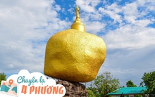 Lạ kỳ hòn đá khổng lồ dát vàng, nằm cheo leo trên vách núi hàng nghìn năm nhờ... 1 sợi tóc