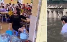 Hà Nội mưa lớn, cô giáo vừa dạy học vừa tát nước, học sinh bơi giữa sân trường