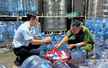 Bơm nước máy vào bình 'phù phép' thành nước Lavie giả bán khắp Hà Nội