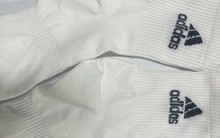 Khởi tố chủ cơ sở sản xuất 200.000 đôi tất giả nhãn hiệu Nike, Adidas, Uniqlo