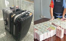 Tịch thu hơn 14,5 tỷ tiền mặt trong vali của 2 nhân viên công ty logistics