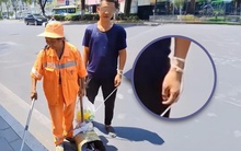 Người mẹ lao công dẫn con trai thiểu năng trí tuệ nhặt rác giữa trời nắng