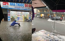 Hà Nội mưa lớn hơn 1 tiếng, đường phố ngập trong "biển nước", giao thông ùn tắc kéo dài