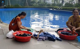Cư dân mang quần áo giặt giũ, múc nước bể bơi để dùng trong "cơn khát" ở Hà Nội