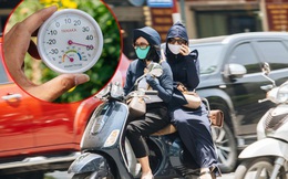 Ảnh: Nhiệt độ ngoài đường tại Hà Nội lên tới 50 độ C, người dân trùm khăn áo kín mít di chuyển trên phố