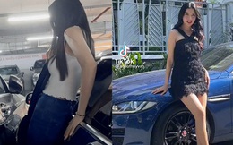 Bị xe bên cạnh 'kèm chặt', Á hậu Thúy Vân tiện 'khoe' thân hình mảnh mai khi cố bước vào trong chiếc Jaguar tiền tỷ