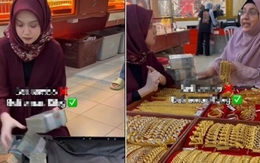 Xôn xao hình ảnh người phụ nữ mang vali tiền mặt để mua 15kg vàng ở Malaysia