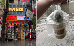 Loạt hàng quán ngập nước vẫn mở cửa, trở thành chỗ trú cho khách giữa thời tiết mưa lớn ở Hà Nội