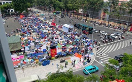 Hà Nội trước ngày tổng duyệt A80: Người dân "đội nắng" giữ chỗ đẹp chờ xem diễu binh