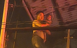 Hình ảnh Đại úy công an băng mình qua lửa, cởi áo che cho bé 18 tháng tuổi gây xúc động mạnh