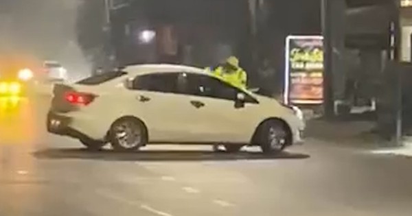 VIDEO: Tài xế ô tô tăng ga hất văng CSGT lên nắp capo bỏ chạy