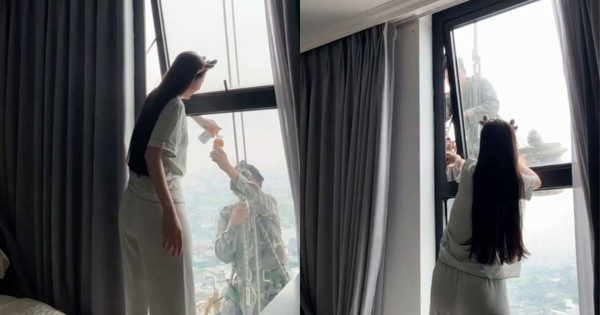 Mát lòng cảnh cô gái mời nước anh thợ treo mình giữa trời nóng lau kính cao ốc